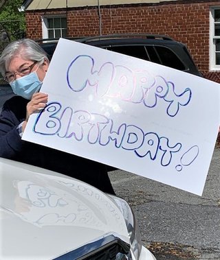 Margie with Birthday Surprise Sign!